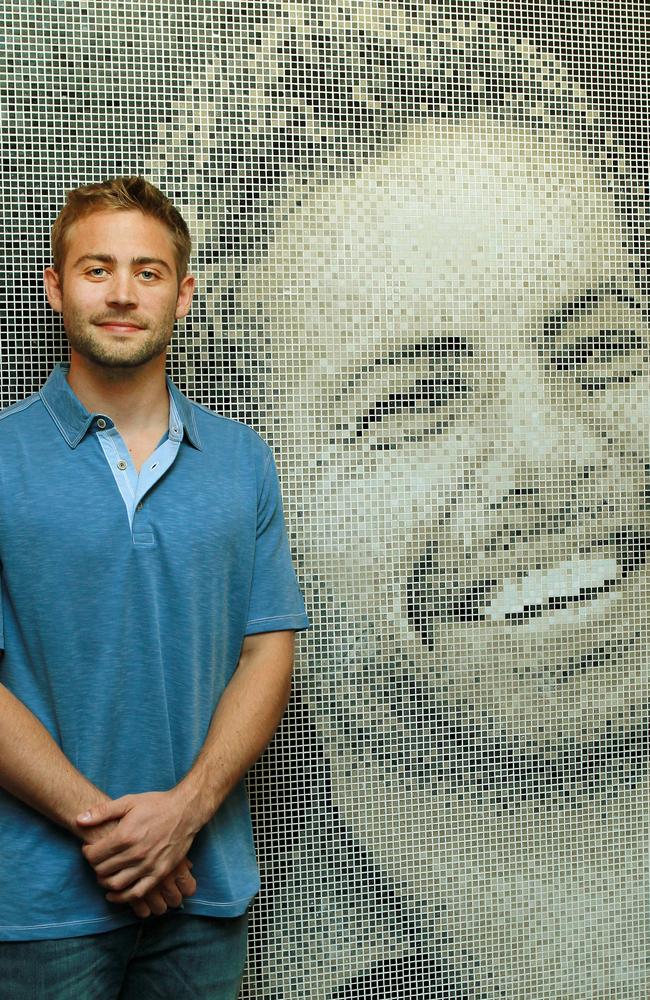 Cody Walker, brother of Paul, beside a mosaic tribute to his late brother. Picture: Janine Eastgate