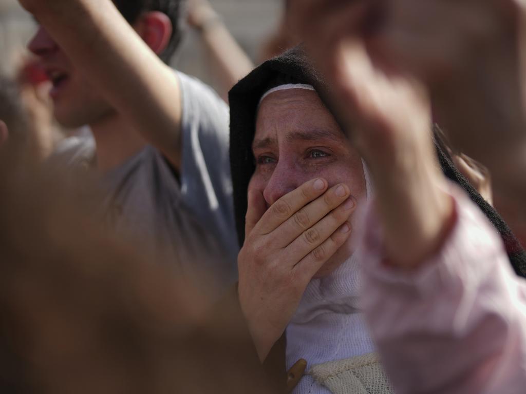 A nun cries as the body of Pope Francis is carried into St. Peter's Basilica. Picture: AP