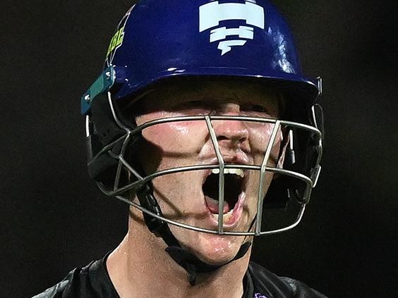 HOBART, AUSTRALIA - JANUARY 27: Mitch Owen of the Hurricanes celebrates scoring a century during the BBL The Final match between Hobart Hurricanes and Sydney Thunder at Ninja Stadium on January 27, 2025 in Hobart, Australia. (Photo by Steve Bell/Getty Images)