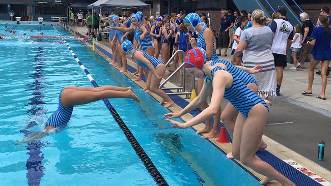 All Hallows School 16As take the plunger ahead of the decider against Mermaids at the BWPL grand finals held at the Valley Pool.