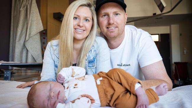 Rosie and James Gilchrist, from South Yarra, with son Louis. Picture: Mark Stewart