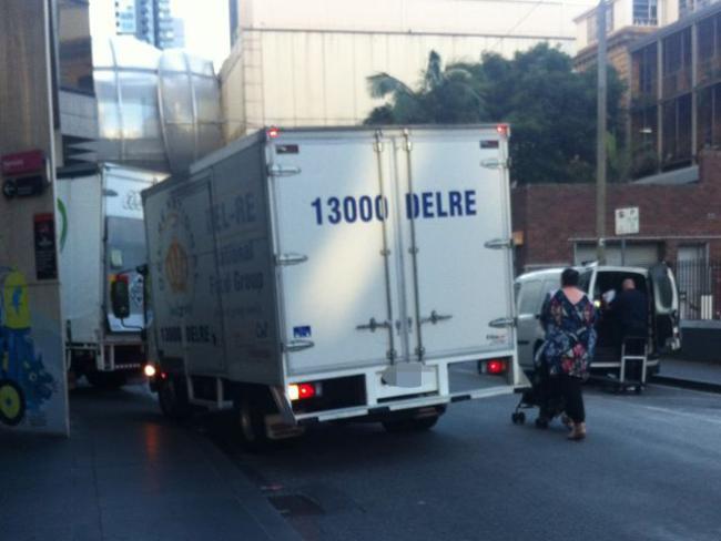 A woman and her child are forced on to the road in Lt Lonsdale St, Melbourne. Picture: Snap Send Solve