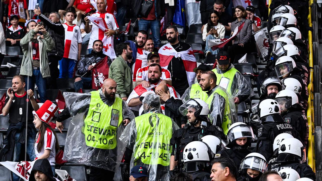 Anti-riot officers were forced to intervene. (Photo by INA FASSBENDER / AFP)