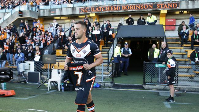 Wests Tigers halfback Luke Brooks walks out the number seven jersey as a tribute to the late Tommy Raudonikis before the NRL match between the Wests Tigers and the North Queensland Cowboys at Leichhardt Oval. Picture: Matt King/Getty Images