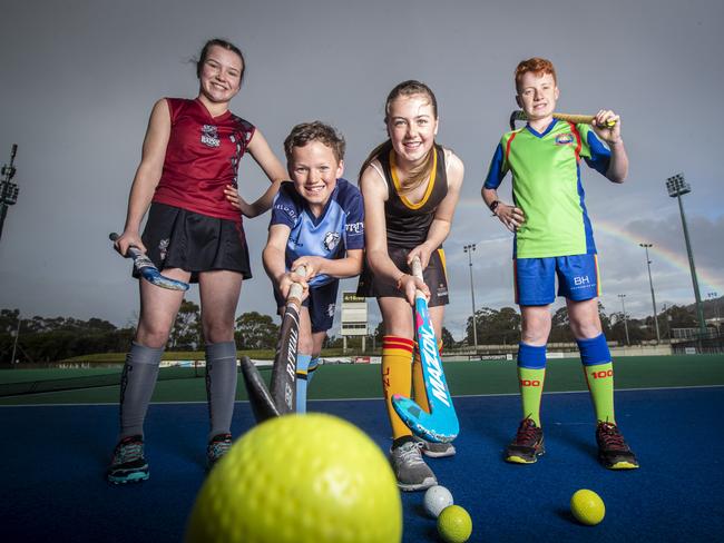 Junior hockey players (L-R) DiamondBacks' Wilhelmina Fish, Angus McMullen from North-West Grads, University's Audrey Bullard and OHA's Jack Woodberry. Picture: LUKE BOWDEN