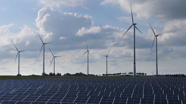 Onshore wind is the single biggest source of electricity, providing nearly a third of the country’s requirements. Wind turbines spin behind a solar energy park near Prenzlau, Germany. Picture: Getty Images