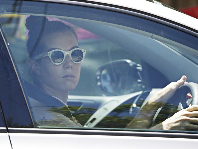 Dr Orly Lavee drives away from her Randwick home on Monday. She alleges she was assaulted there by partner Andrew O’Keefe. Picture: Adam Yip.