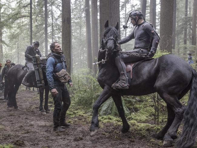 Horsing around ... Jason Clarke and Andy Serkis in a scene from Dawn of the Plane of the Apes. Pic: Twentieth Century Fox Film Corporation