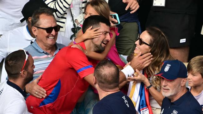 Novak Djokovic celebrates with his family in the crowd after beating Spain's Carlos Alcaraz in their men's singles gold medal match. Picture: AFP