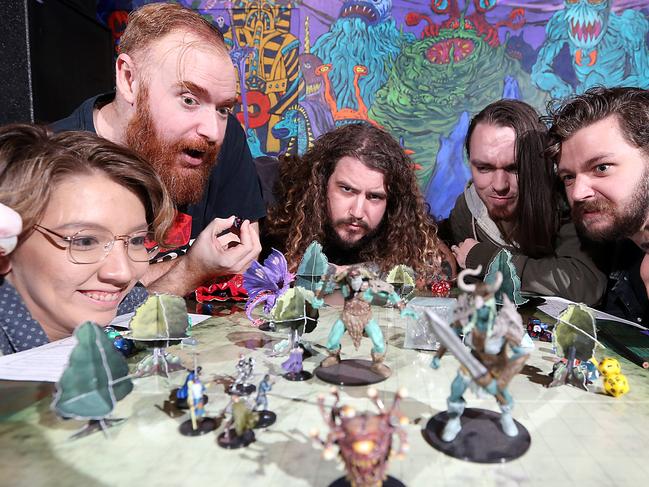 Feature for Saturday papers on the renewed popularity of Dungeons and Dragons. Due to coverage on popular shows such as Stranger Things, Big Bang Theory etc - and the fact many of the geeks who grew up playing the game are now company managers - it is staging an amazing comeback.Players (L-R) Morgan Bidlake (with Thomathan the bird), Sean Deane, Mitch Wilkins, Tim Sifontes-Holzberger, Tyson Hargreaves, Jade Murray at Netherworld, an arcade/pub in Brisbane's Fortitude Valley.Brisbane 30th May 2019 AAP Image/Richard Gosling