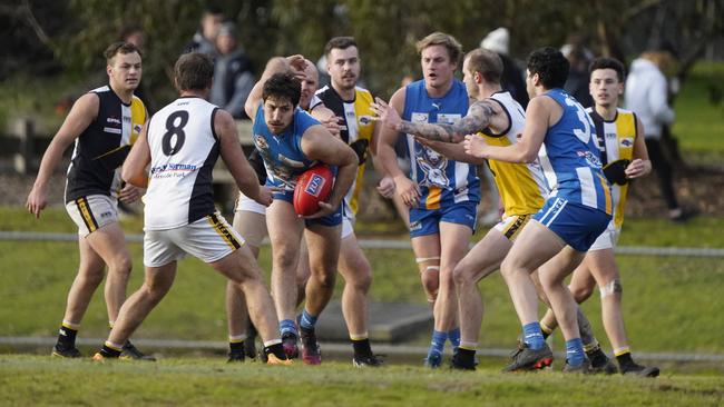 EFL: Croydon North-MLOC teammates and Chirnside Park rivals surround Dylan Thierau. Picture: Valeriu Campan