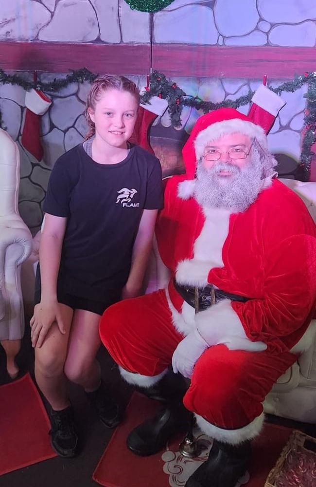 Mckenzee Sengstock with Santa (Damien Symes): Kondy Parks Christmas break up party with Flame Studios Hervey Bay 2023 - Fraser Coast. Sent in by Carlie Sengstock.