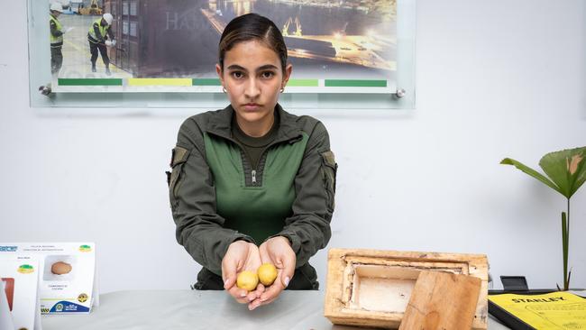 Patrol officer Daniella Patina of the Colombian National Police shows how drug cartels conceal illicit substances. Picture: Jason Edwards