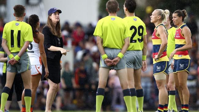 Crows board member Kate Ellis MP tosses the coin at a Crows AFLW game. Picture Sarah Reed