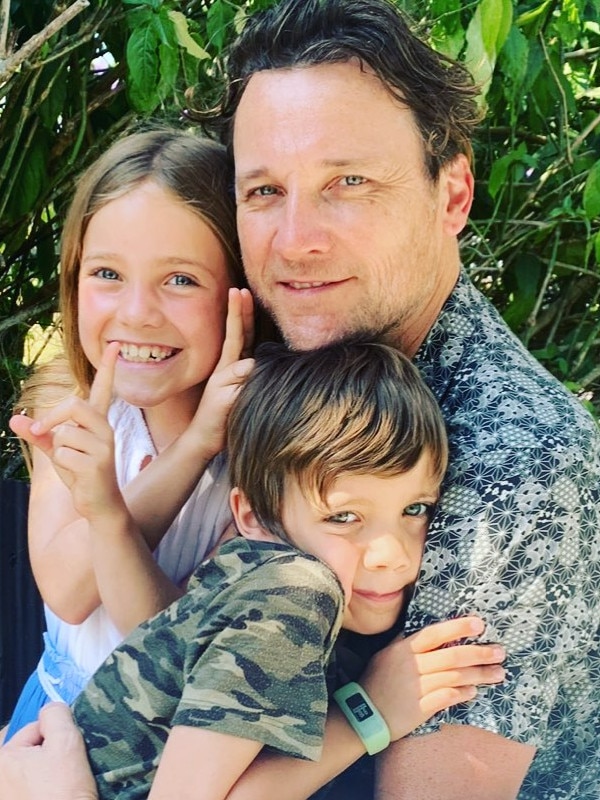 Nat's ex-husband Cam and their two children.