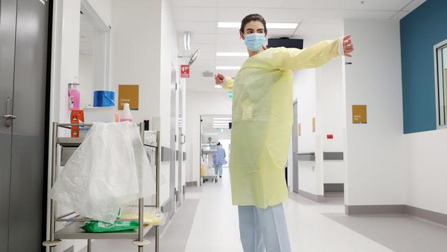 Ashleigh Peters is a nurse at Westmead Hospital and works with coronavirus patients. Pictured at work in the COVID-19 ward at Westmead Hospital. Picture: Jonathan Ng