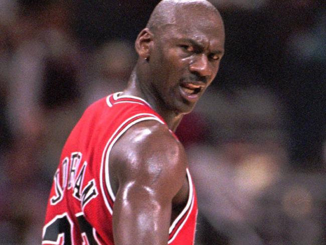 11/02/1998. Chicago Bulls' Michael Jordan looks back at an official after he was hacked on the arm but no foul was called during the second quarter against the Charlotte Hornets, in Charlotte, N.C. (AP Photo/Rick Havner). Basketball