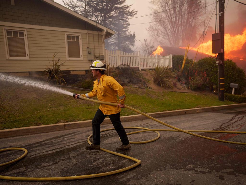 Over 250 firefighters and 46 engines are currently trying to tackle the blaze which remains uncontained. Picture: Eric Thayer/Getty Images/AFP