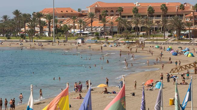 Tourists at Las Vistas beach on Tenerife: many Britons are now stuck here. Picture: AFP.