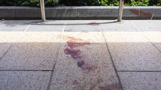 The intersection of Ruthven and Russell Sts in the Toowoomba CBD where a person was assaulted, unconfirmed blood stains are seen on the pavement, Sunday, November 24, 2024.