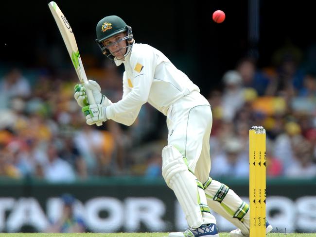 Peter Handscomb playing at shot off the back foot at the Gabba on Friday.