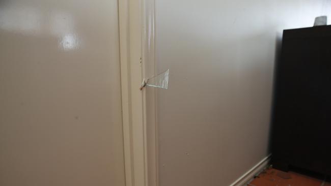 A shard of glass lodged in a doorframe in the Geers’ home. Picture: Peter Ristevski