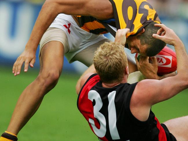 Fletcher collars a young Lance Franklin in 1995, one of 450 career tackles.