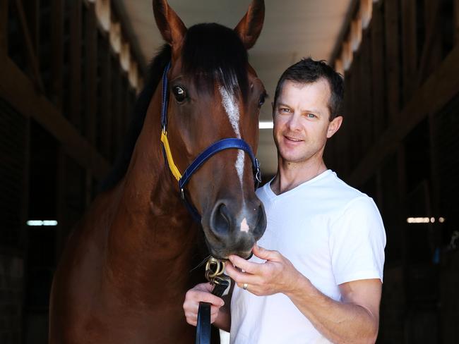 Pictured is Horse Trainer Jason Deamer with Unbeaten race horse Bon Amis, in Newcastle today. Picture: Tim Hunter.