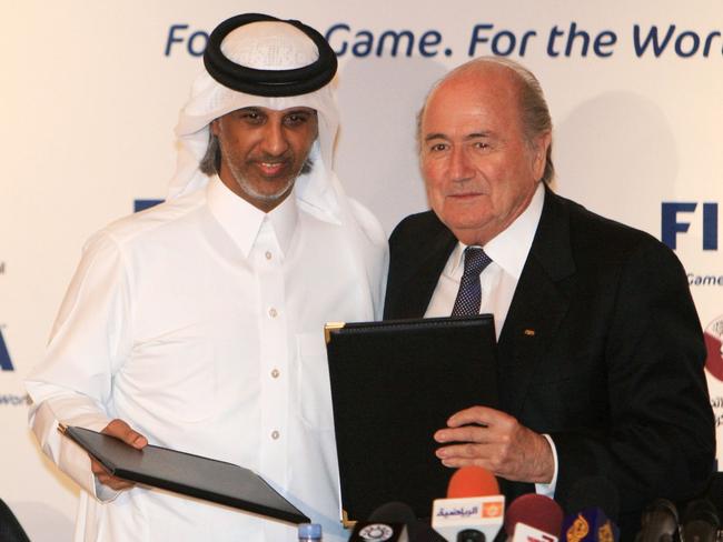 FIFA president Sepp Blatter (R) has admitted the Qatari bid bought votes by giving gifts to countries.