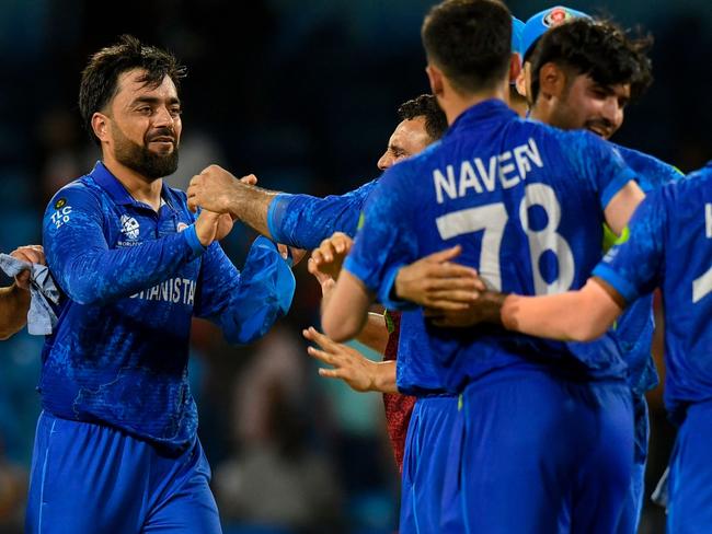 Rashid Khan (L) calls for Australia to change their mind on playing Afghanistan outside of World Cups. Picture: Randy Brooks / AFP