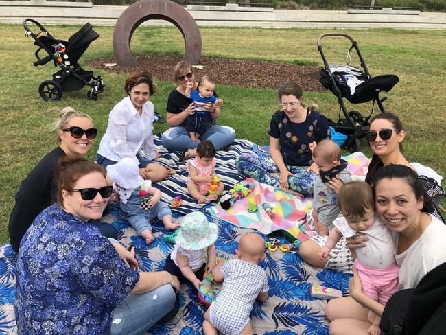 A mums group enjoy the nice weather at a park in The Ponds today.