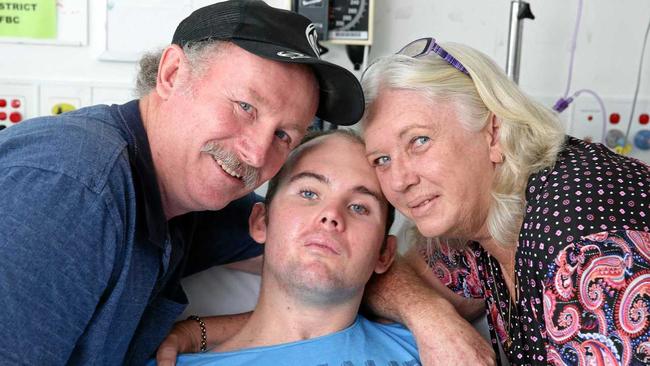 HOME FOR LIFE: Chrys Barker can now enjoy life at home with parents Allan and Betty, after receiving a record $20 million in damages after he suffered a severe brain injury in a car crash. Picture: Liam Kidston