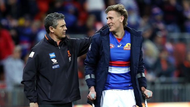 Cameron comforts injured Bulldog Aaron Naughton after last year’s elimination final. Picture: Phil Hillyard