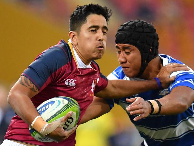 Sefa Inivale (left) of Brisbane State High palms off Eyzaiah Ulia (right) of Nudgee College during the St Joseph's Nudgee College and Brisbane State High School GPS Rugby match at Suncorp Stadium in Brisbane, Saturday, July 27, 2019. (AAP Image/Darren England) NO ARCHIVING, EDITORIAL USE ONLY