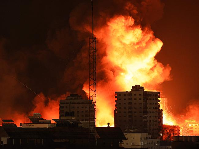 A fireball erupts during Israeli bombardment of Gaza City on October 9. (Photo by MAHMUD HAMS / AFP)