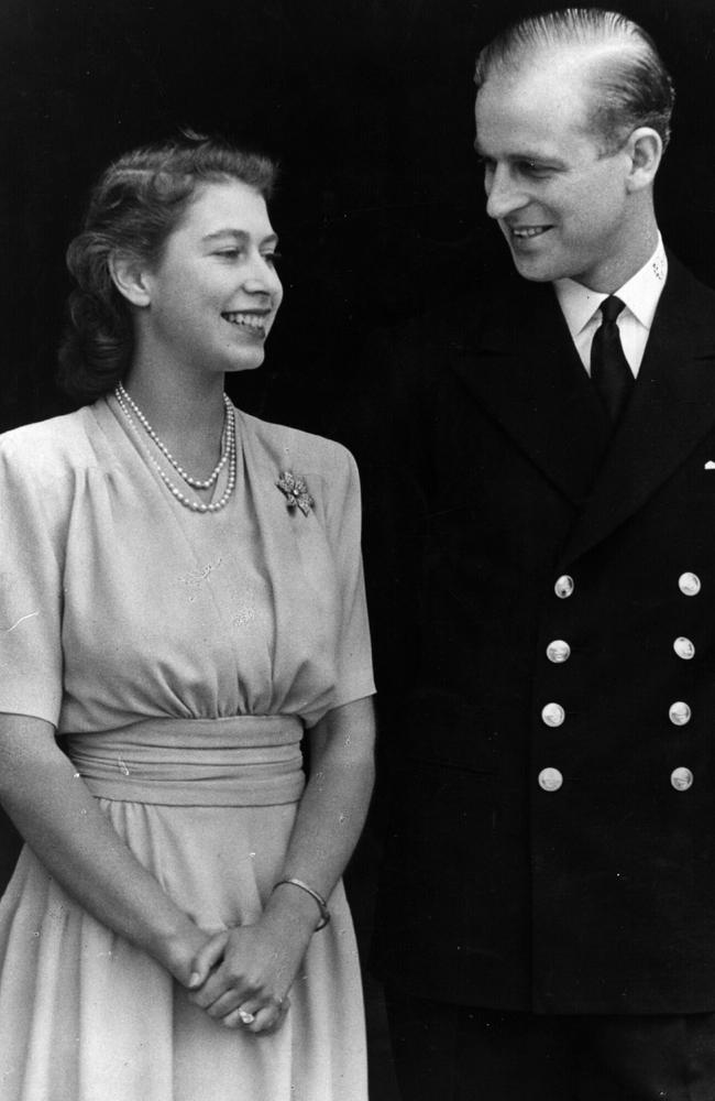 Queen Elizabeth and Prince Philip at their engagement at Buckingham Palace in 1947. Picture: Getty Images.