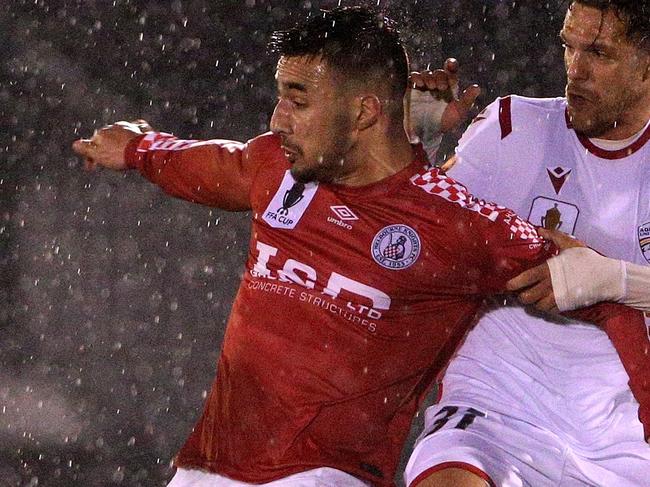 Gian Albano of the Knights (left) contests with Mirko Boland of United during the FFA Cup Round of 32 match between the Melbourne Knights and Adelaide United at Knights Stadium in Melbourne, Wednesday, August 7, 2019. (AAP Image/Hamish Blair) NO ARCHIVING, EDITORIAL USE ONLY