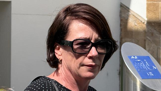 Jennifer Anne Frew leaving Wollongong Local Court on Wednesday December 4 2024 after pleading guilty to break and enter and dishonestly obtaining financial advantage by deception. Picture: Dylan Arvela