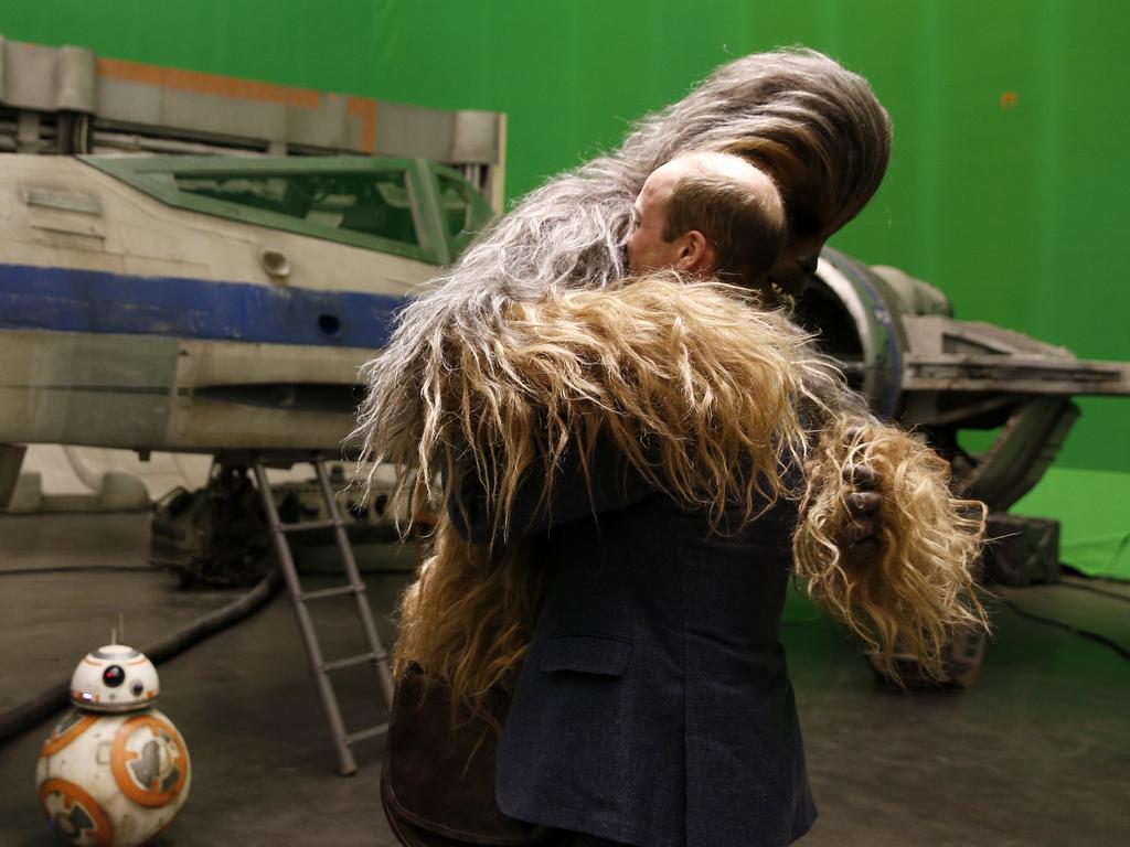 Britain’s Prince William talks with the Star Wars character Chewbacca during a tour of the Star Wars sets at Pinewood studios in Iver Heath, west of London on Tuesday April 19, 2016. Picture: AP