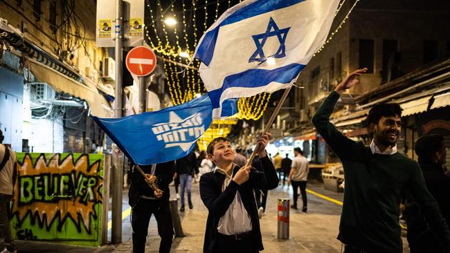 People in Israel celebrate after the military confirmed the death of Yahya Sinwar. Picture: John Wessels/AFP