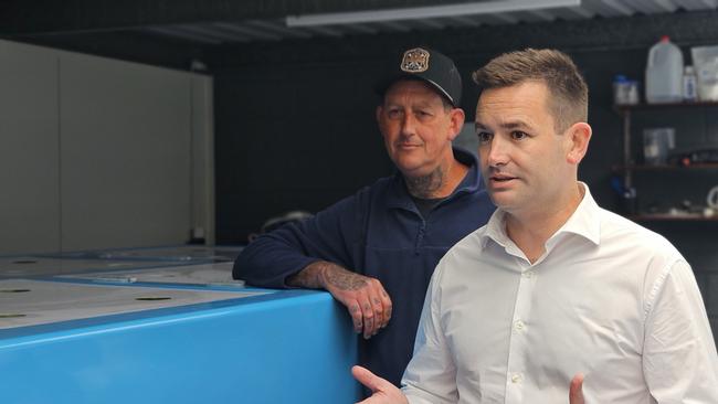 Wrasse fisherman Jacob Chambers and Labor leader MP Dean Winter speak to the media at Lindisfarne on Thursday, October 31, 2024.