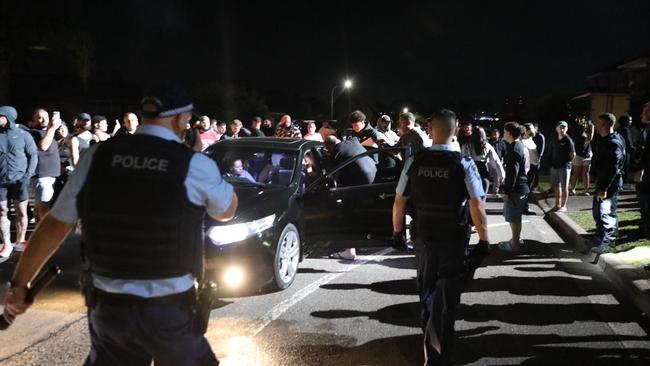 The crowd outside the church on Monday night. Picture: Liam Mendes