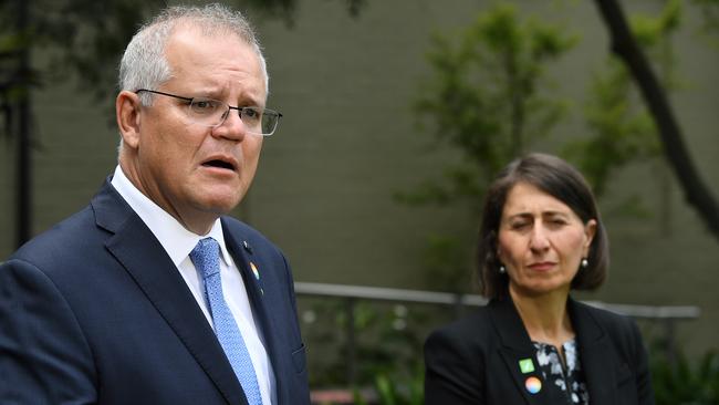 Gladys Berejiklian watches while Scott Morrison speaks at the SYD Brain and Mind Centre at Camperdown in Sydney in 2021. Picture: Joel Carrett