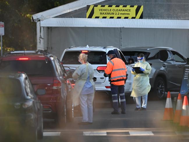 NSW Health workers conduct COVID-19 tests at a drive-through clinic at Bressington Park in Sydney. Picture: NCA NewsWire/Steven Saphore