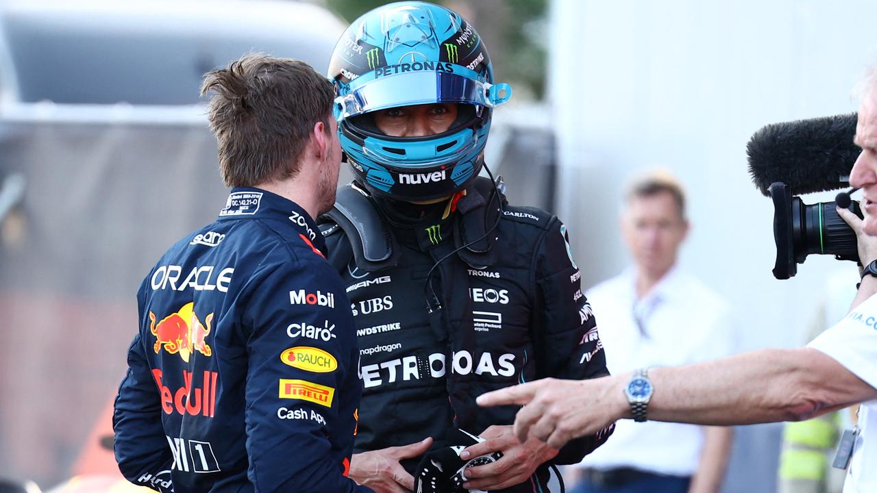 Max Verstappen let George Russell know about it. Photo by LISI NIESNER / POOL / AFP.