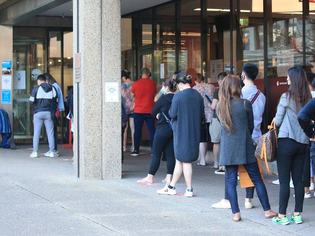 SYDNEY, AUSTRALIA - NewsWire Photos MAY 10, 2021 -  A large line of people has been observed at the Service NSW Outlet in Haymarket.Picture: NCA NewsWire / Christian Gilles
