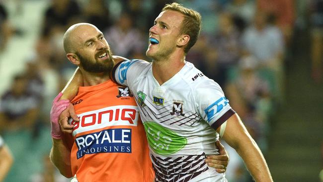 Daly Cherry-Evans is helped off the field after being injured against the Roosters.