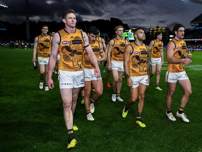 Dejected Hawks players leave the ground after losing in Round 10. Picture: Mark Brake/Getty Images.