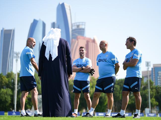 Manchester City's Pep Guardiola, Khaldoon Al Mubarak, Xabier Mancisidor, Rodolfo Borrell and Carles Planchart meet during a December training session in Abu Dhabi. Picture: Tom Flathers/Manchester City FC via Getty Images