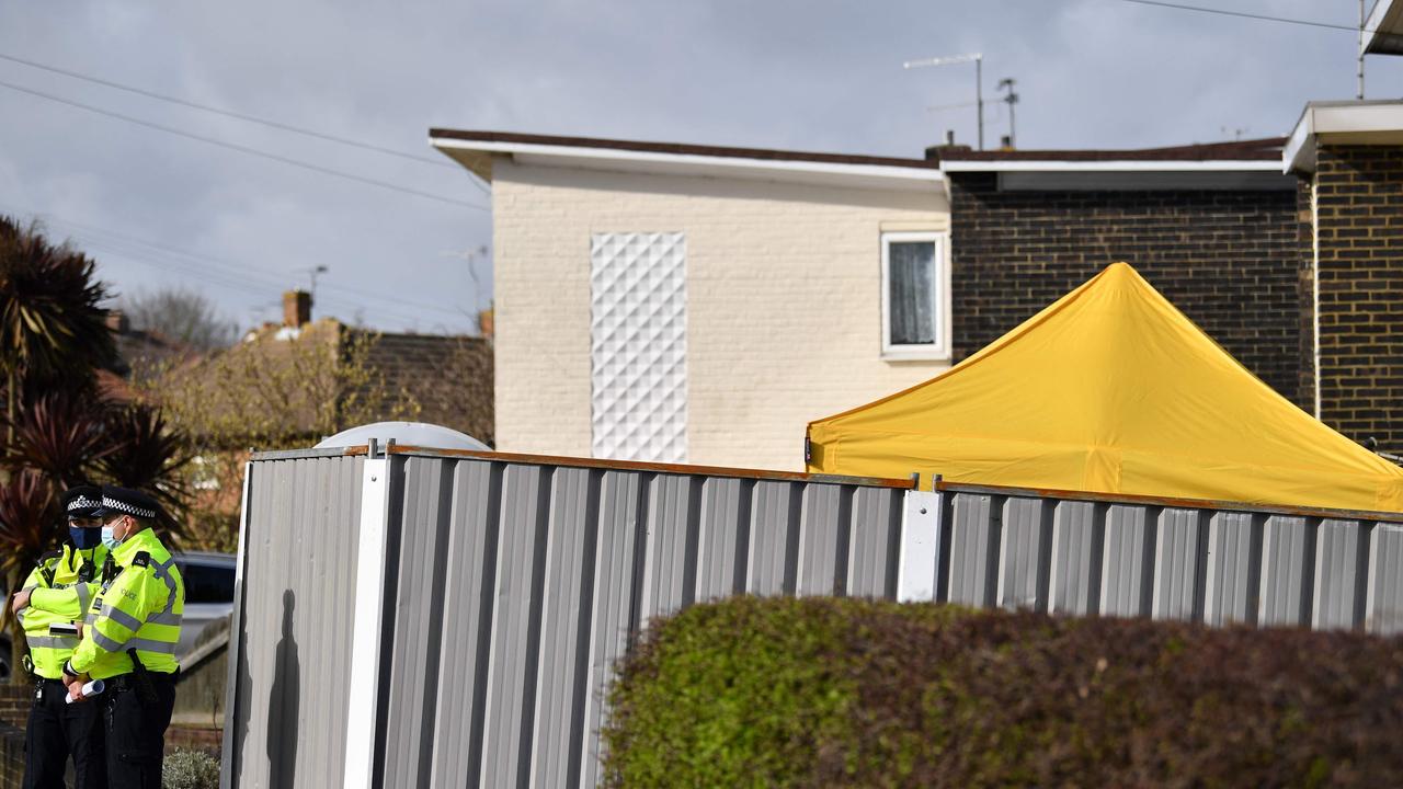 Officers standing guard around the home of the suspect in Deal, Kent. Picture: Ben Stansall/AFP